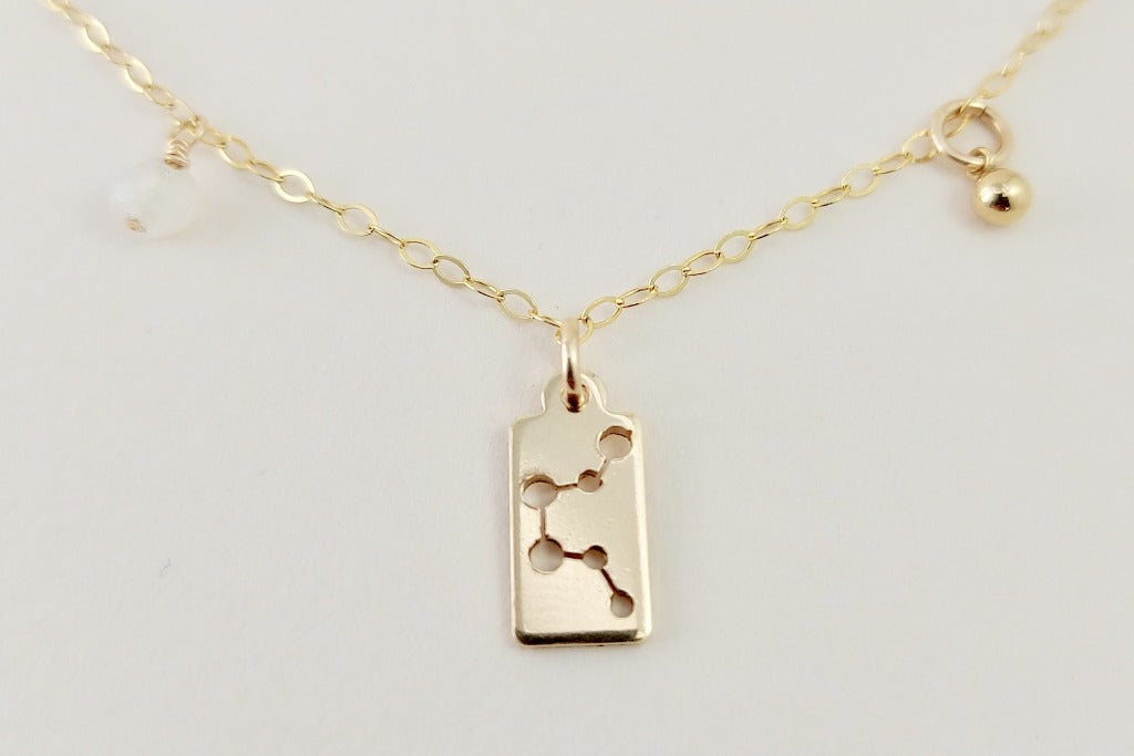 Gold aquarius necklace