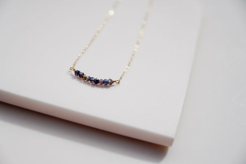 The gold strand gem necklace with iolite