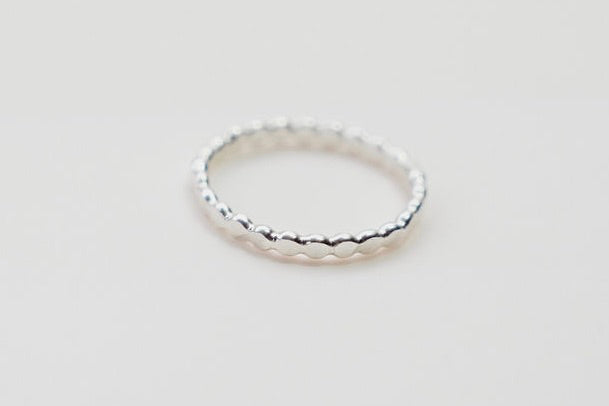 Our simple silver flat ball stacking ring