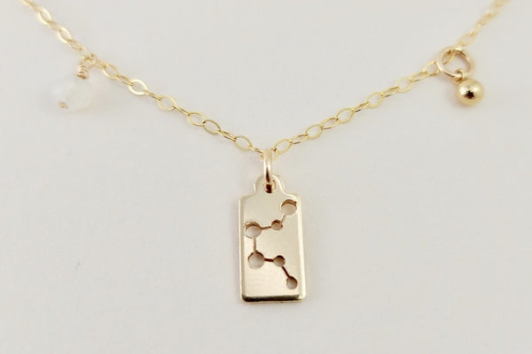 Gold aquarius necklace