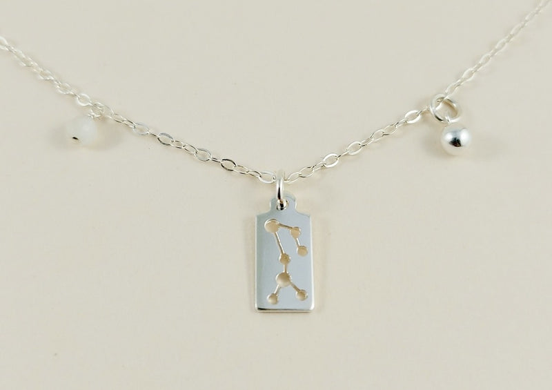 the silver sagittarius necklace